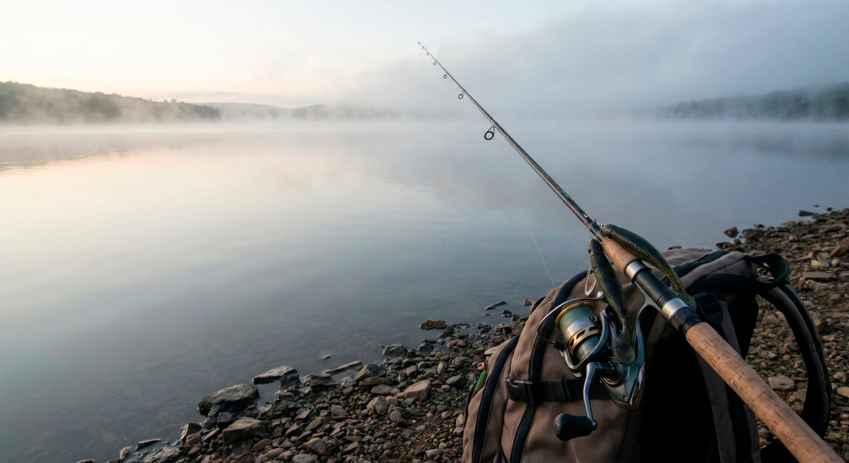 Утренний пейзаж водоема со снастями на переднем плане